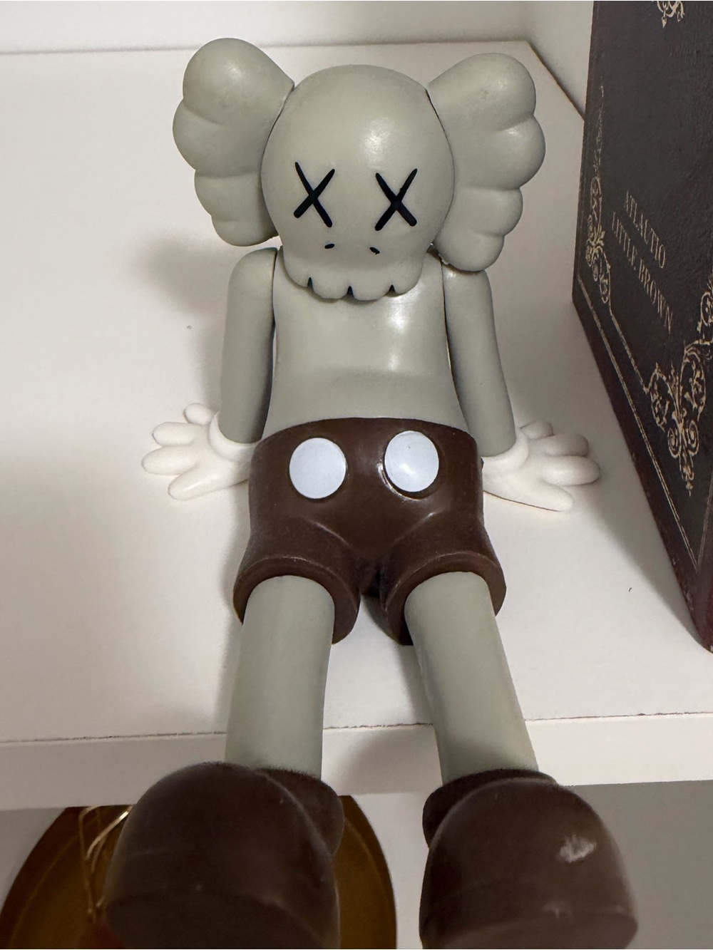 KAWS Small Figurine with Brown Shorts